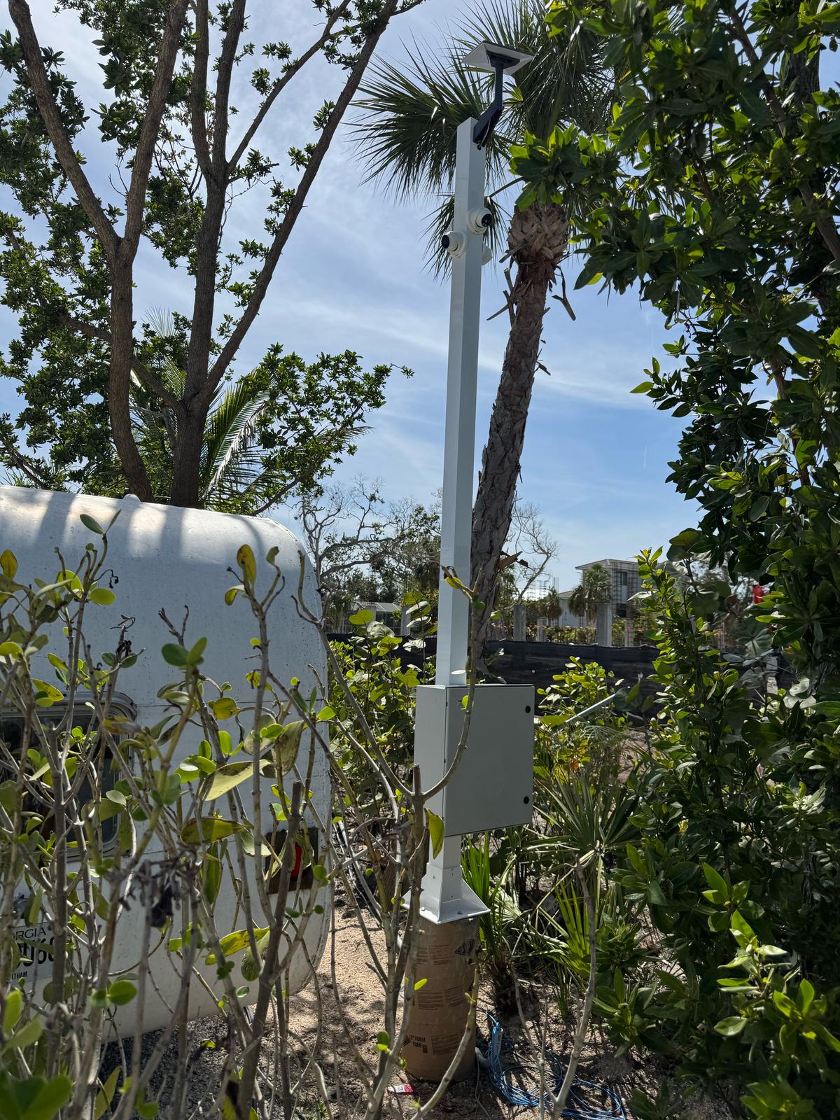 Custom solar-powered security camera pole with NEMA enclosure